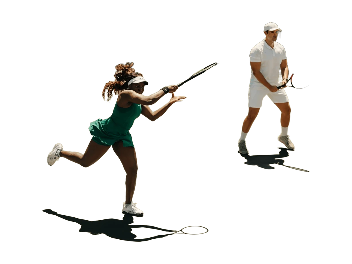 Two tennis players on an outdoor court during a point.